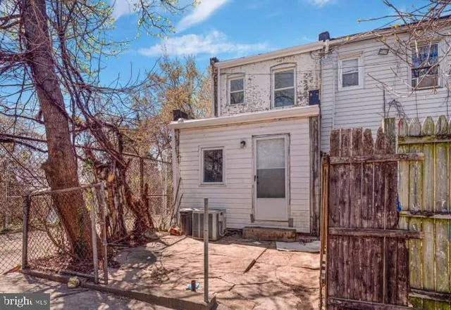 a front view of a house with parking