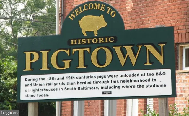 a view of a brick house with roof and a table