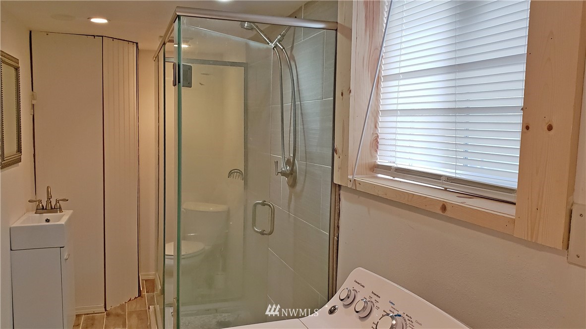2124 7th Street Bremerton, WA 98312 - Photo 16 of 17 a bathroom with a shower and a sink