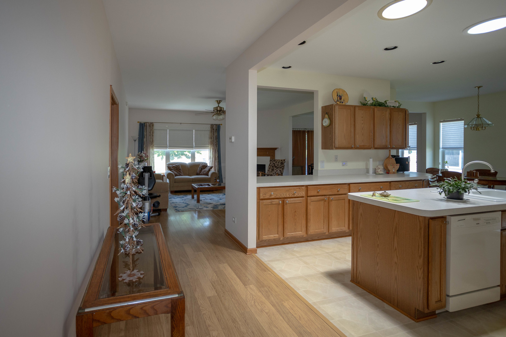 212 Rodeo Drive, Unit 2179 Grayslake, IL 60030 - Photo 9 of 31 a kitchen with kitchen island granite countertop a stove and a sink