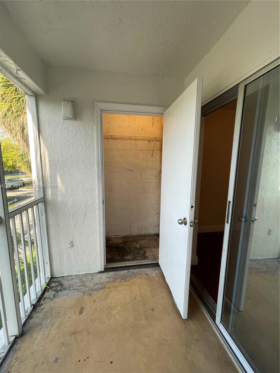 5686 Rock Island Road, Unit 114 Tamarac, FL 33319 - Photo 18 of 32 an empty room with windows