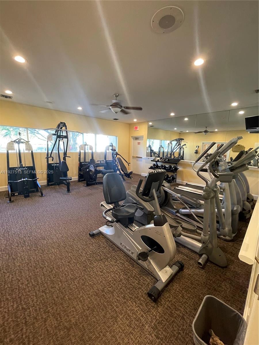 5686 Rock Island Road, Unit 114 Tamarac, FL 33319 - Photo 26 of 32 a view of a room with gym equipment