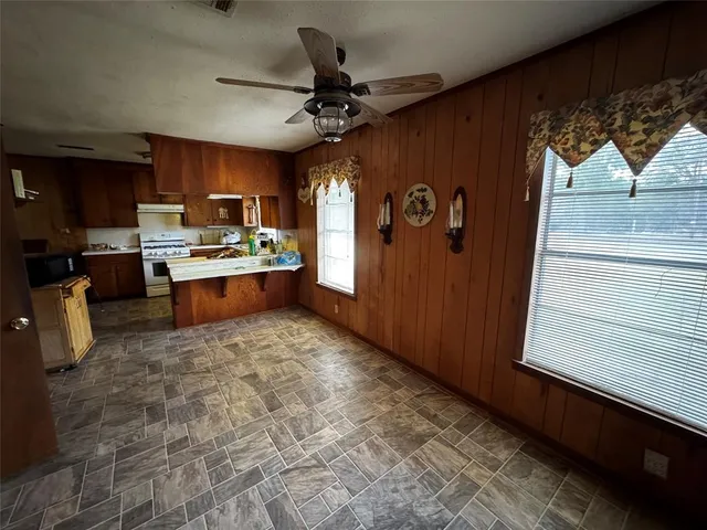 a kitchen with a refrigerator and a sink