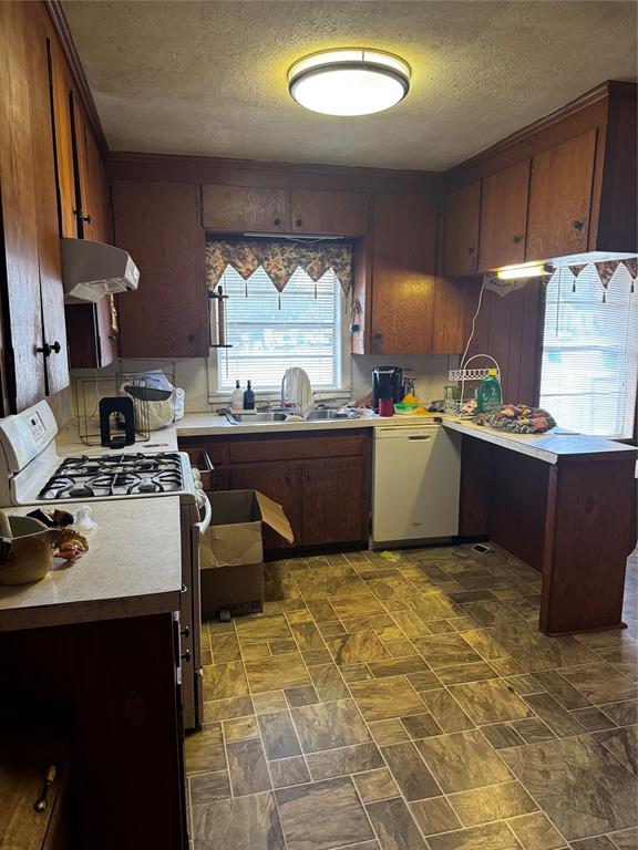 276 Hebron Road Lisbon, LA 71040 - Photo 13 of 15 a kitchen with a stove a sink and a table