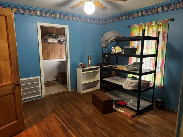 a bedroom with bunk bed and a window