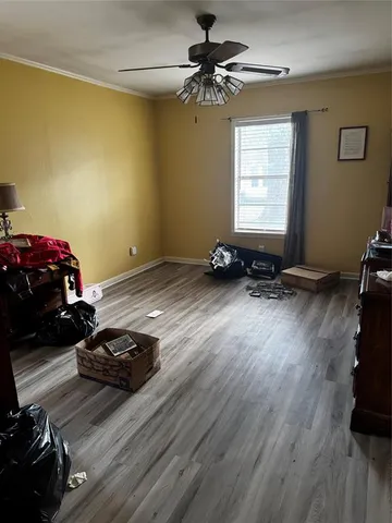 a room that has a bed and a chandelier