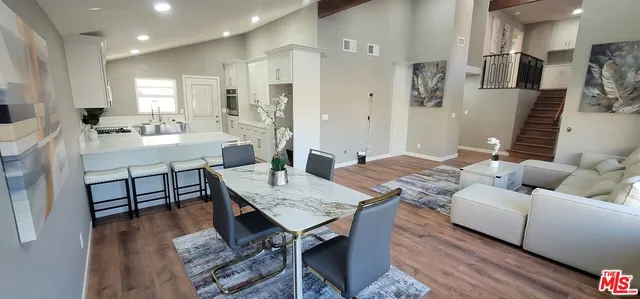 a living room with furniture and a table