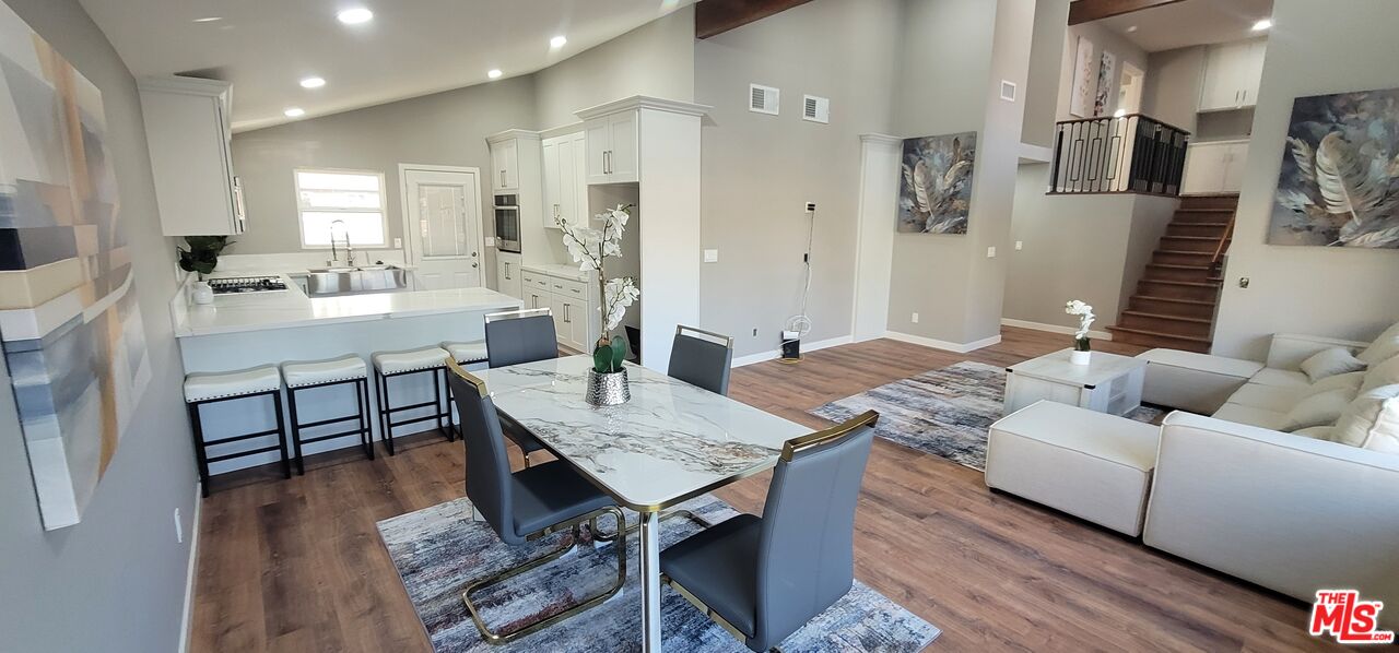 20456 Strathern Street Winnetka, CA 91306 - Photo 11 of 37 a living room with furniture and a table