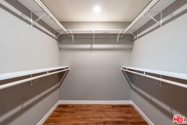 a view of room with racks on the wall