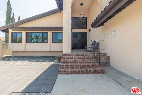 a view of house with front door