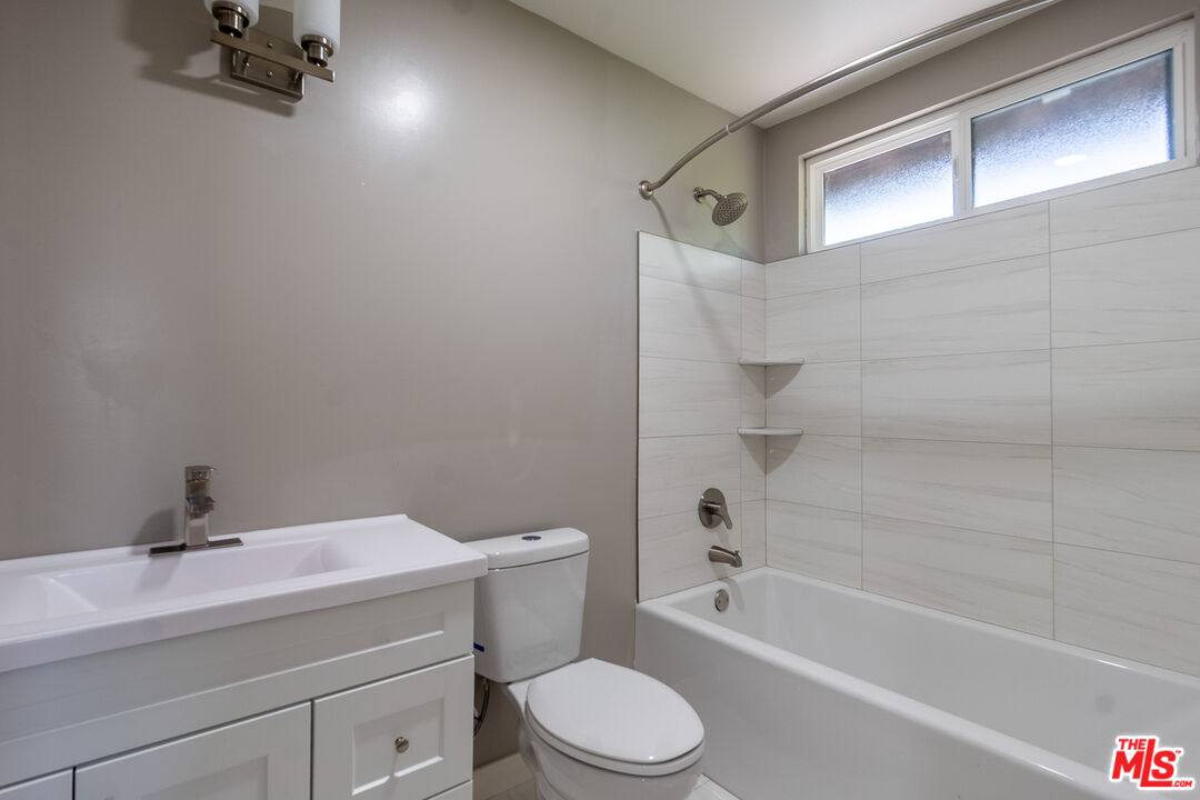 20456 Strathern Street Winnetka, CA 91306 - Photo 26 of 37 a bathroom with a sink toilet and shower