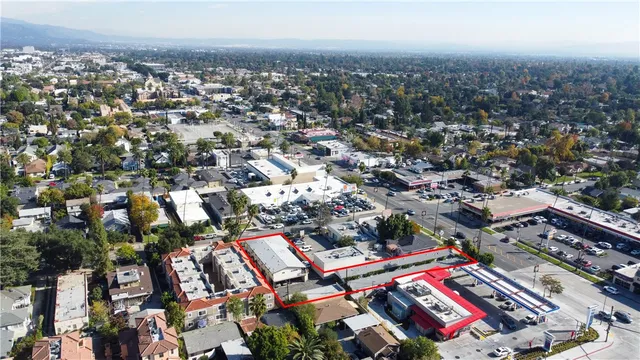 an aerial view of residential house and sandy dunes