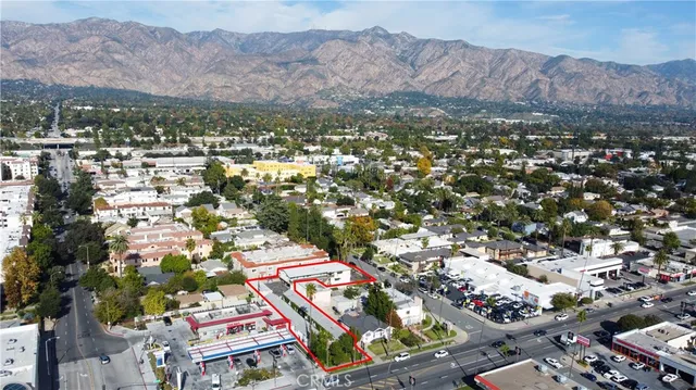 an empty room with fan and windows