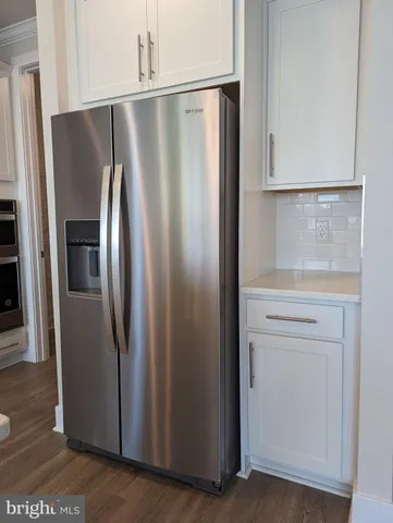 a kitchen with a stove and cabinets