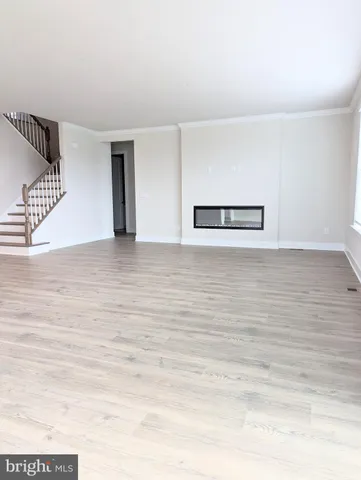 a view of an empty room with stairs