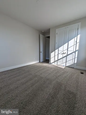 a bathroom with a shower and toilet