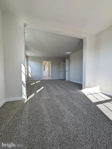 a kitchen with stainless steel appliances granite countertop a sink a stove and white cabinets