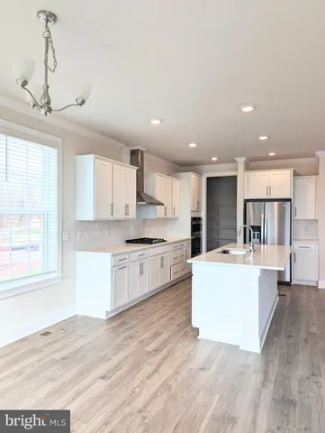 a refrigerator freezer sitting inside of a kitchen