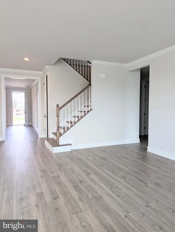 a view of kitchen with wooden floor and electronic appliances