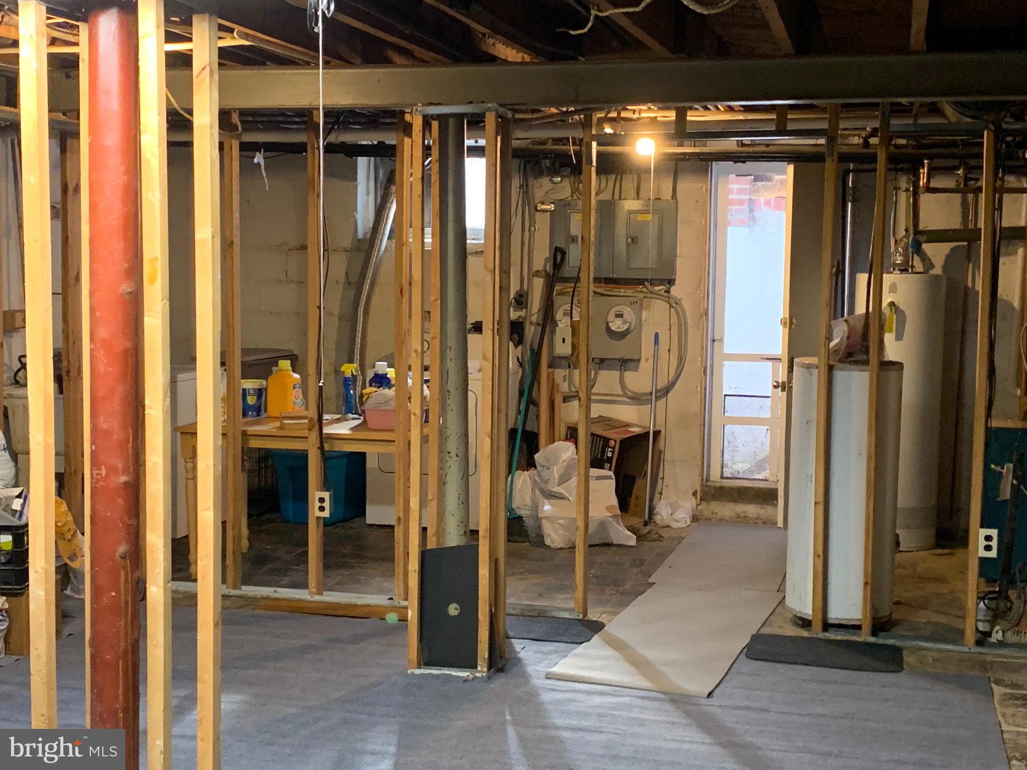 922 Elm Ridge Avenue Baltimore, MD 21229 - Photo 20 of 22 Unfinished lower level with walk-out stairs
