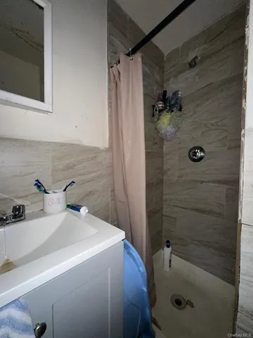 a bathroom with a sink and shower