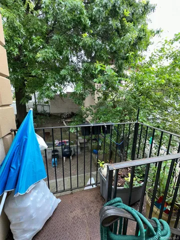 a view of a balcony with chairs