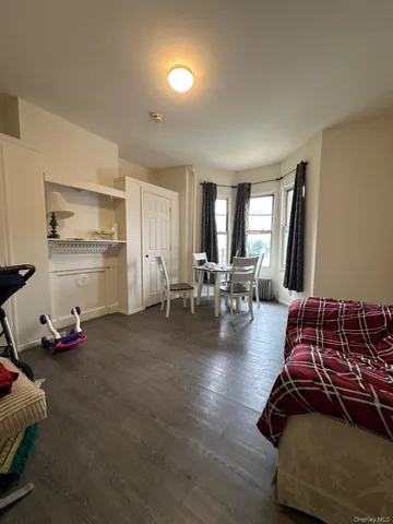 a room with furniture and a wooden floor