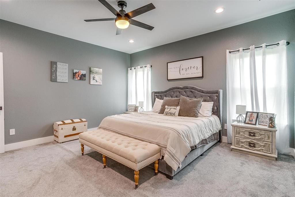 3095 County Road 905 Joshua, TX 76058 - Photo 13 of 38 a bedroom with a bed and a chandelier