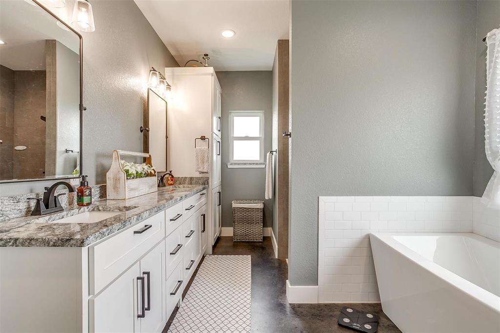 3095 County Road 905 Joshua, TX 76058 - Photo 15 of 38 a bathroom with a granite countertop tub sink and mirror
