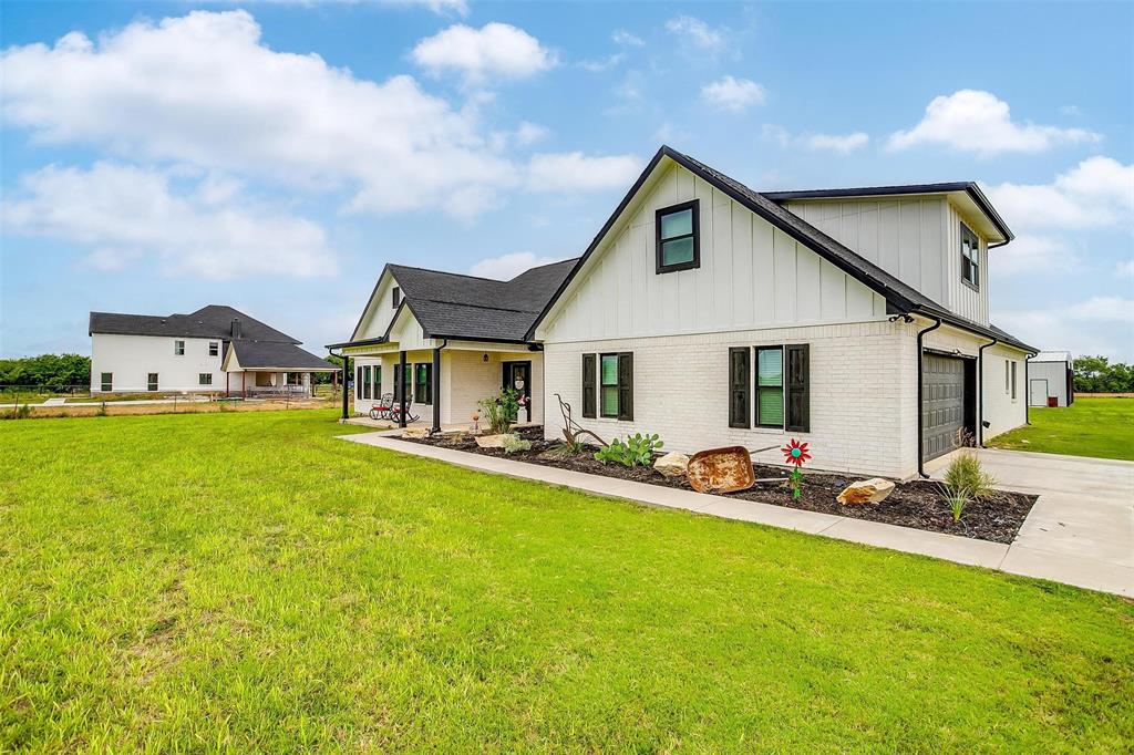 3095 County Road 905 Joshua, TX 76058 - Photo 2 of 38 a front view of house with yard and porch