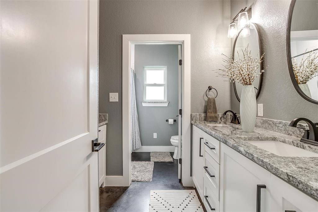 3095 County Road 905 Joshua, TX 76058 - Photo 24 of 38 a spacious bathroom with a granite countertop sink and a mirror