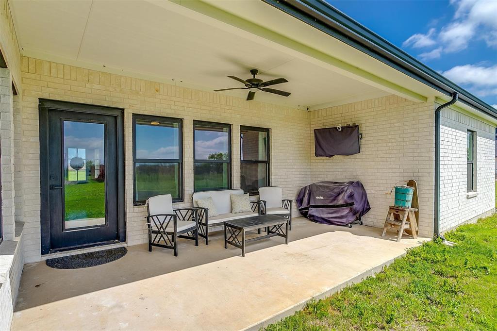 3095 County Road 905 Joshua, TX 76058 - Photo 32 of 38 a building outdoor space with patio furniture and potted plants