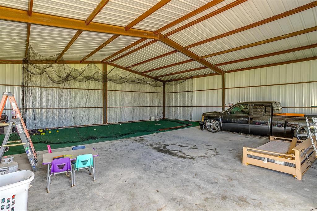 3095 County Road 905 Joshua, TX 76058 - Photo 37 of 38 a car parked in a garage