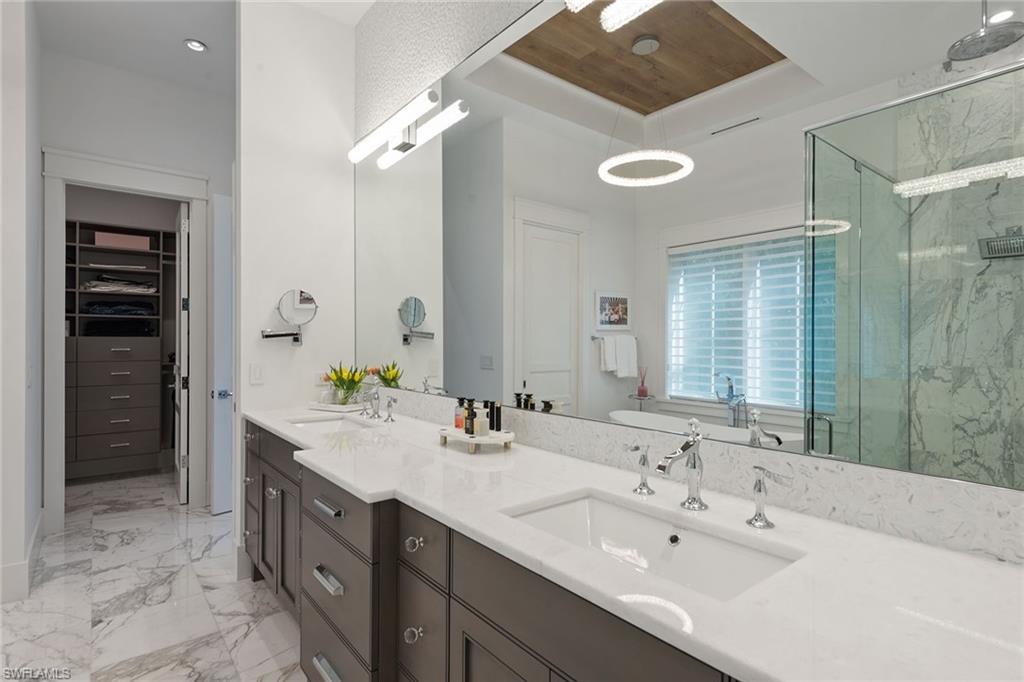 770 Park Street Naples, FL 34102 - Photo 11 of 34 a bathroom with a double vanity sink mirror and double