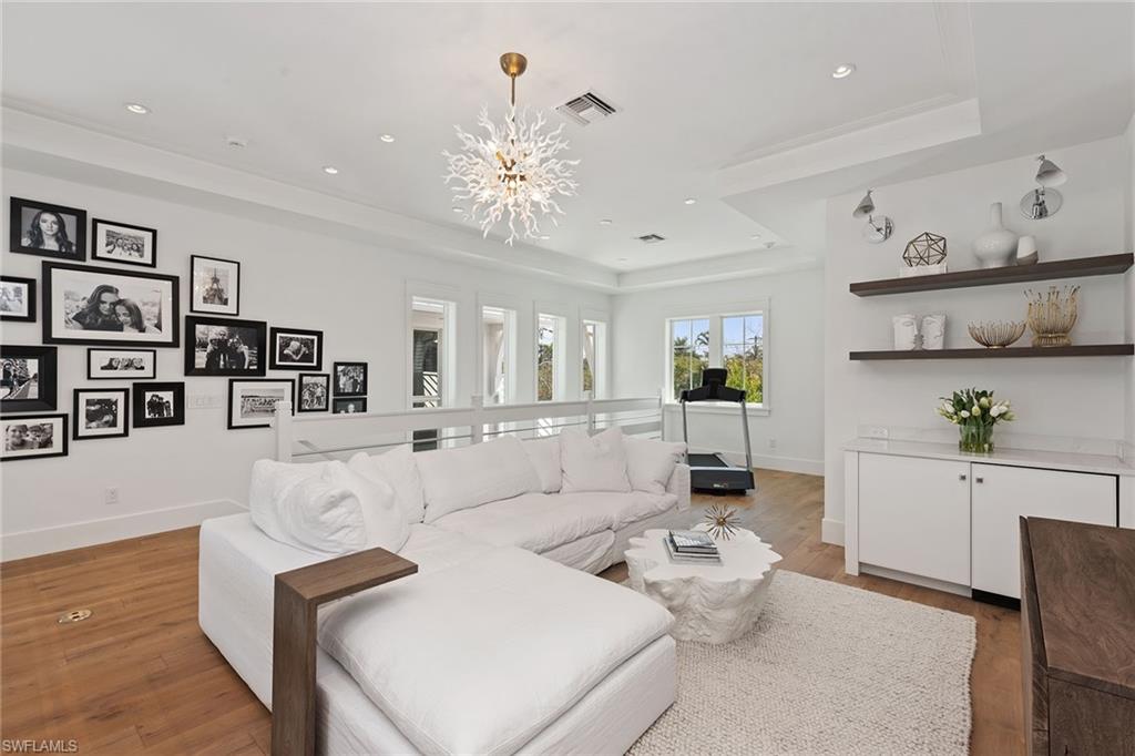 770 Park Street Naples, FL 34102 - Photo 12 of 34 a living room with furniture and kitchen view