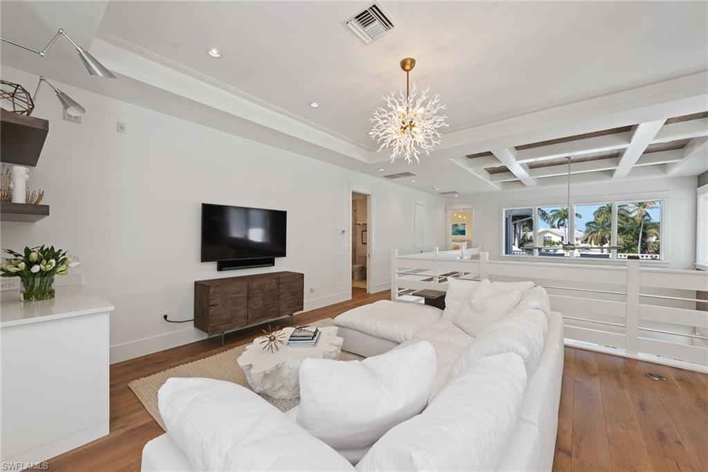 770 Park Street Naples, FL 34102 - Photo 13 of 34 a living room with furniture and a flat screen tv