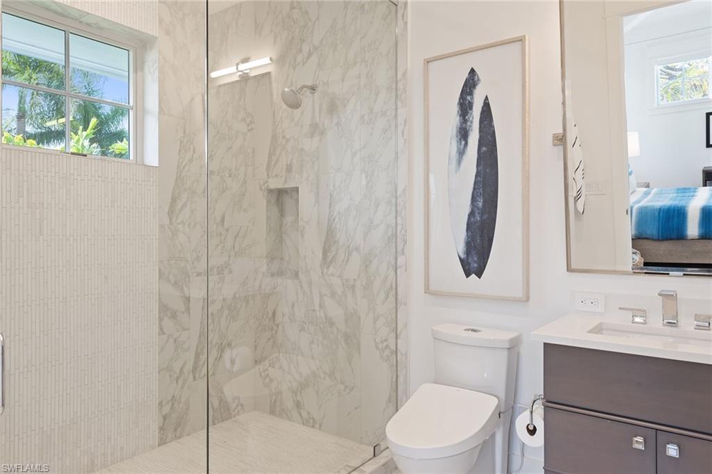 770 Park Street Naples, FL 34102 - Photo 15 of 34 a bathroom with a toilet sink and shower
