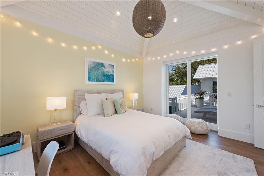 770 Park Street Naples, FL 34102 - Photo 16 of 34 a bedroom with a bed and a large window