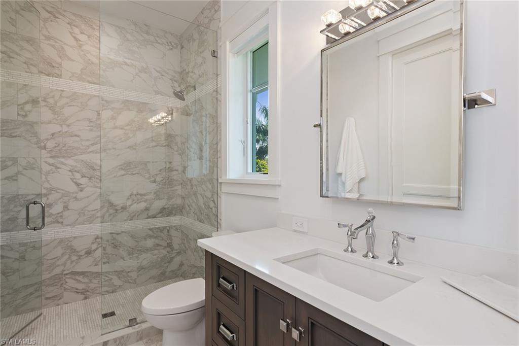 770 Park Street Naples, FL 34102 - Photo 17 of 34 a bathroom with a sink toilet and shower