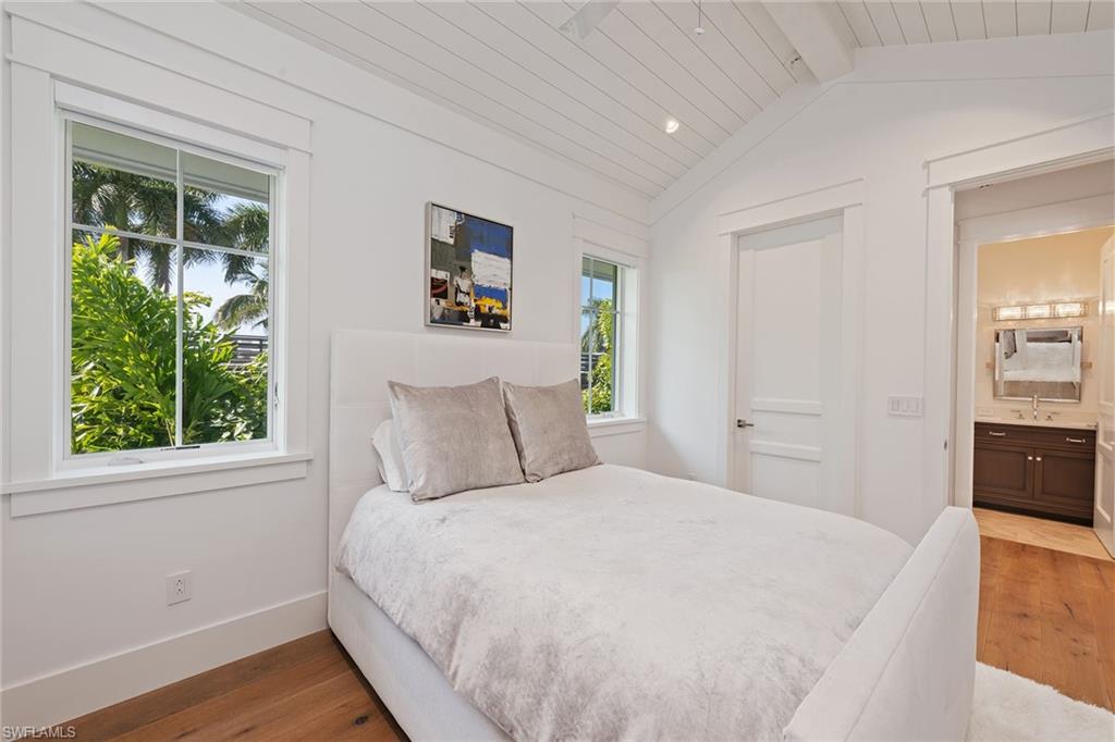 770 Park Street Naples, FL 34102 - Photo 18 of 34 a bed room with a bed and a window