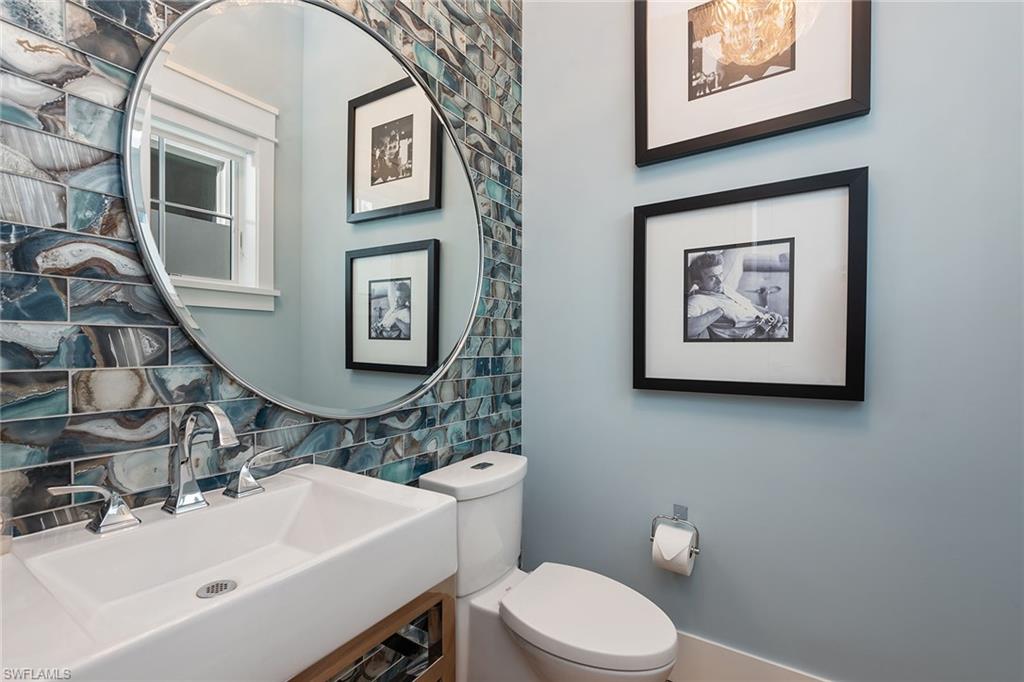 770 Park Street Naples, FL 34102 - Photo 20 of 34 a bathroom with a sink mirror and toilet