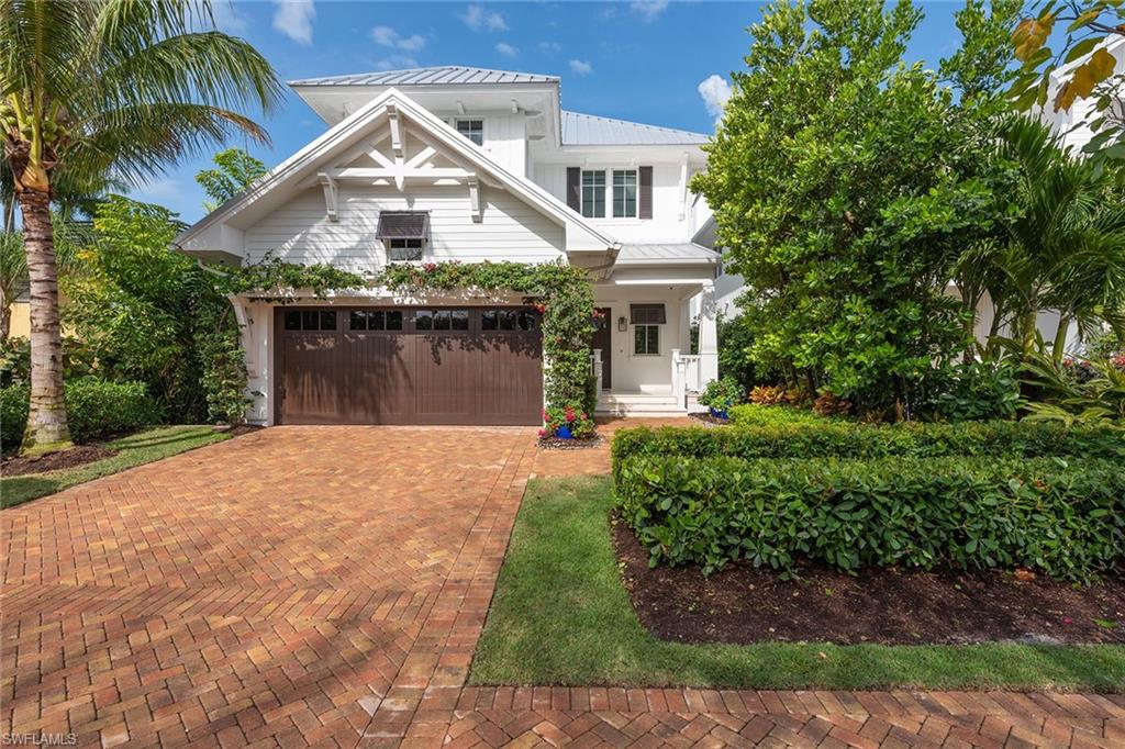 770 Park Street Naples, FL 34102 - Photo 21 of 34 a front view of a house with a yard and garage