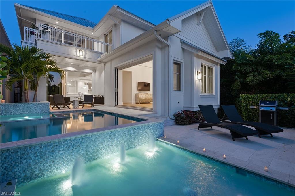 770 Park Street Naples, FL 34102 - Photo 22 of 34 a view of a house with swimming pool and sitting area