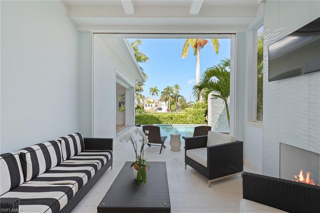 770 Park Street Naples, FL 34102 - Photo 25 of 34 a living room with furniture and a large window