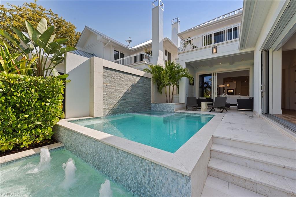 770 Park Street Naples, FL 34102 - Photo 26 of 34 a view of a house with pool and sitting area