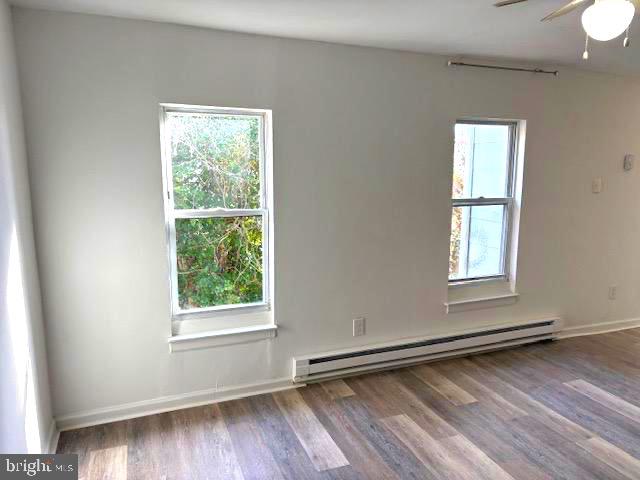 502 South Main Street, Unit B Williamstown, NJ 08094 - Photo 11 of 19 a view of an empty room with wooden floor and a window