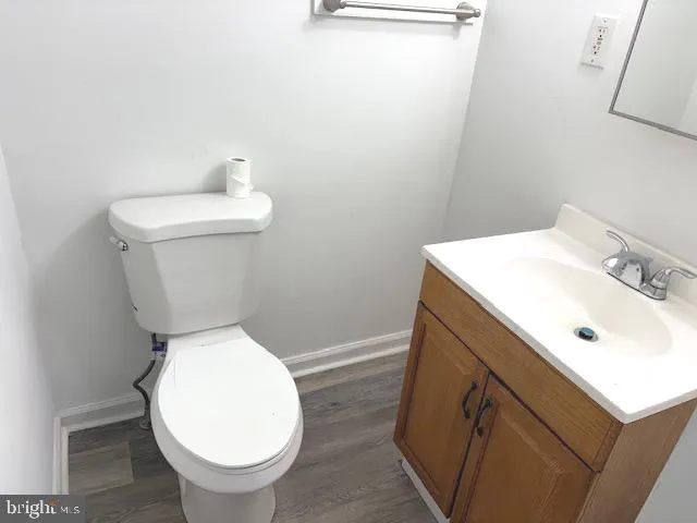 a bathroom with a sink toilet and vanity