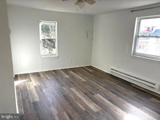 a view of a room that has a bed and a window