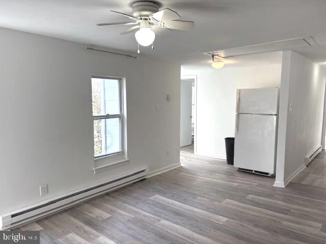 502 South Main Street, Unit B Williamstown, NJ 08094 - Photo 10 of 19 wooden floor in an empty room with a window