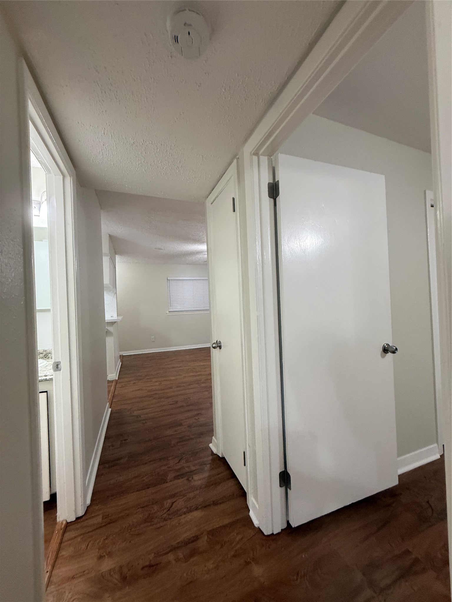 201 South Kaysie Street, Unit 17 Angleton, TX 77515 - Photo 13 of 18 a view of a hallway with wooden floor and staircase